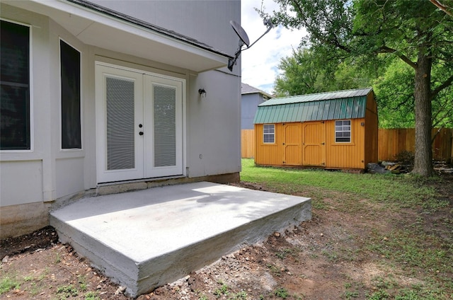 exterior space with a shed and a patio