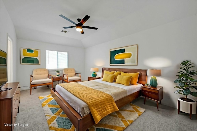 carpeted bedroom featuring ceiling fan and lofted ceiling