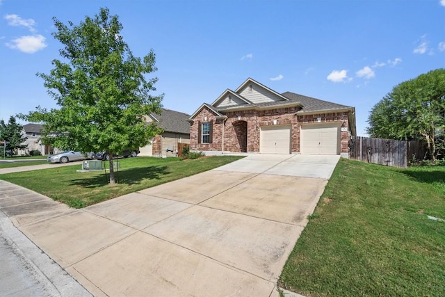 view of front of house with a garage and a front lawn