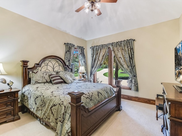 carpeted bedroom featuring access to exterior and ceiling fan