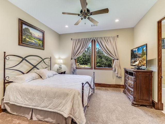 bedroom featuring light carpet and ceiling fan