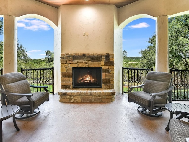 exterior space with an outdoor stone fireplace