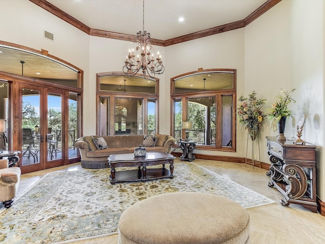 living room with crown molding, french doors, and a healthy amount of sunlight