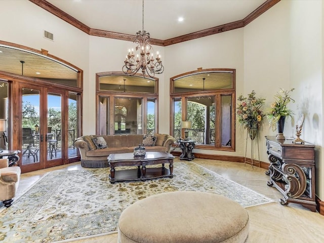 6000 Lantern View Dr, Jonestown, TX 78645 - living area with french doors, plenty of natural light, crown molding, a chandelier, and a high ceiling