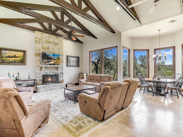 living room with ceiling fan with notable chandelier, plenty of natural light, high vaulted ceiling, and beamed ceiling