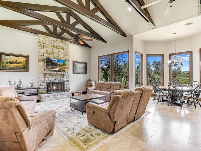 6000 Lantern View Dr, Jonestown, TX 78645 - living area with beam ceiling, a chandelier, a fireplace, high vaulted ceiling, and ceiling fan