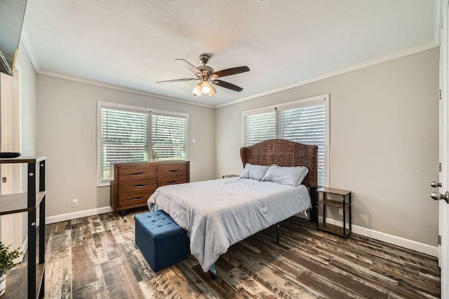 bedroom with a ceiling fan, wood finished floors, baseboards, a textured ceiling, and crown molding