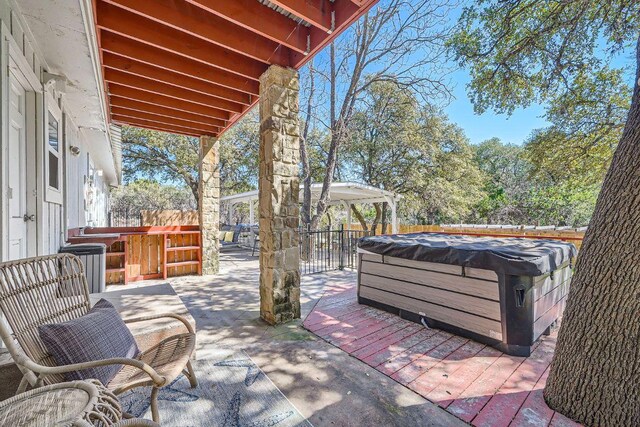 7507 Davy Dr, Volente, TX 78641 - view of patio featuring a hot tub and a gazebo
