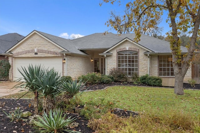 single story home with a garage and a front lawn