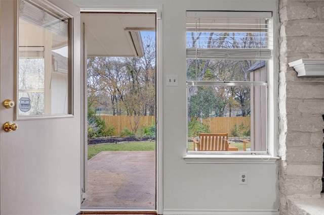 doorway to outside featuring a healthy amount of sunlight