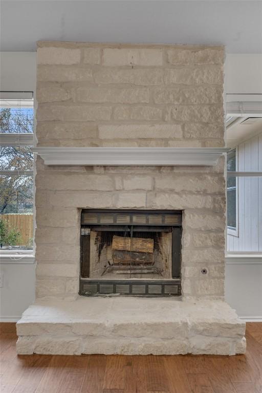 room details featuring hardwood / wood-style floors and a fireplace