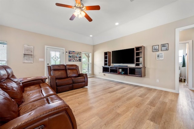 living room with baseboards, recessed lighting, a ceiling fan, and light wood-style floors