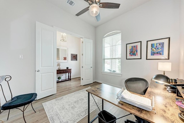 office featuring light wood-style floors, visible vents, ceiling fan, and baseboards