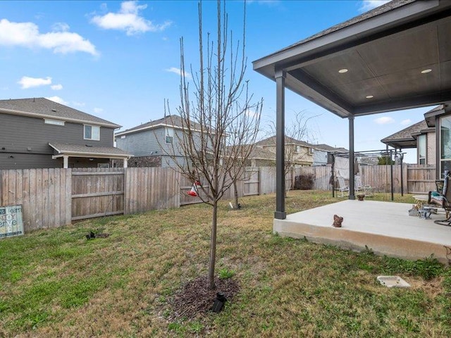 view of yard featuring a fenced backyard and a patio