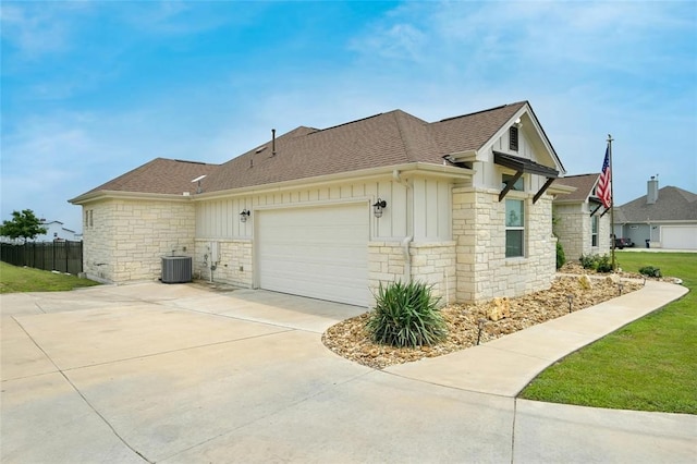 view of home's exterior featuring cooling unit and a garage