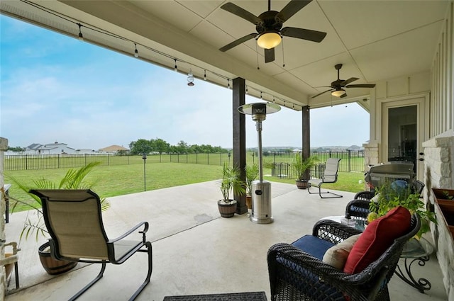 view of patio / terrace featuring ceiling fan, outdoor lounge area, and a rural view