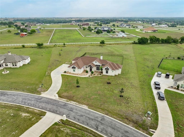 birds eye view of property featuring a rural view