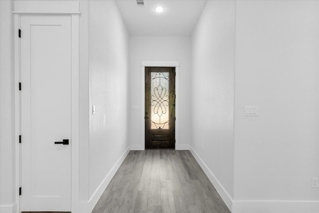 doorway to outside with light hardwood / wood-style flooring