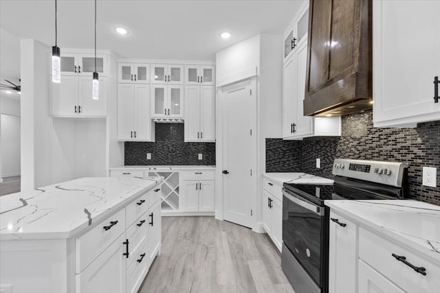 kitchen with white cabinets, ceiling fan, electric stove, and light hardwood / wood-style floors