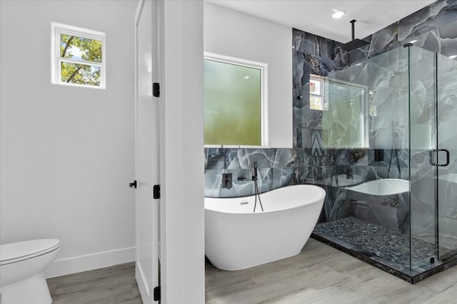 bathroom with toilet, wood-type flooring, independent shower and bath, and decorative backsplash