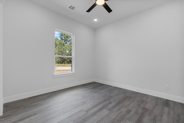 spare room featuring ceiling fan and hardwood / wood-style floors