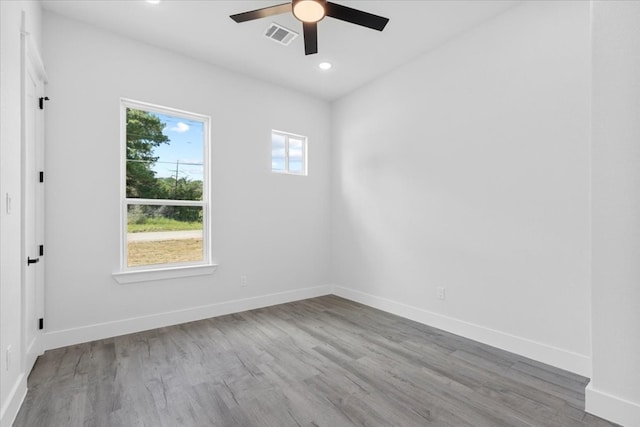 empty room featuring ceiling fan and wood-type flooring