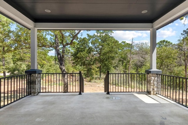 view of patio featuring a balcony