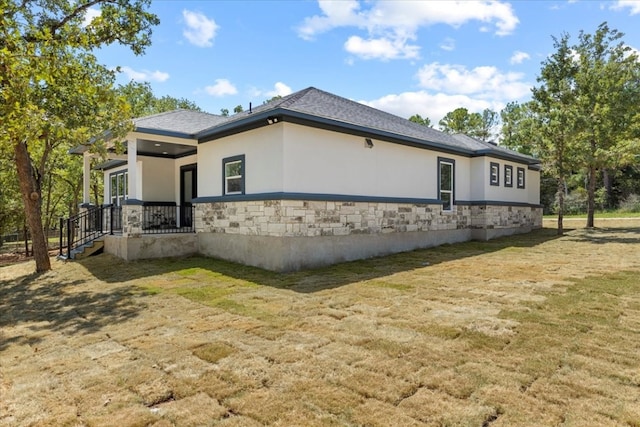 view of property exterior featuring a lawn