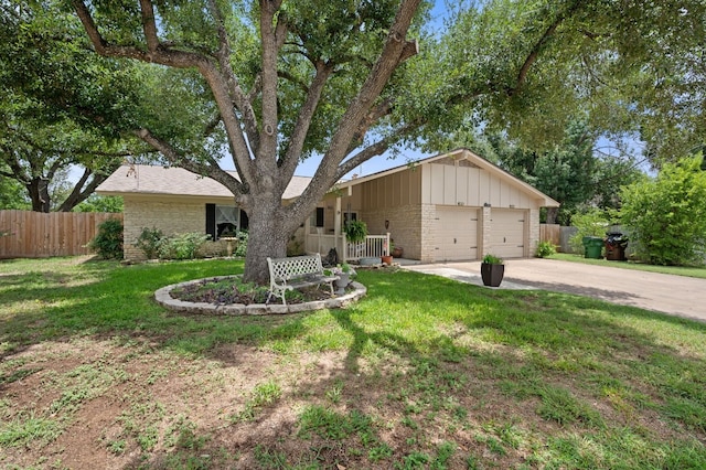 ranch-style home with a garage and a front lawn