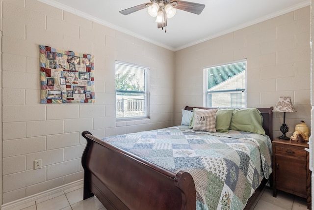 bedroom with ceiling fan, brick wall, and light tile patterned floors