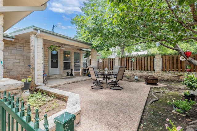 view of patio / terrace with an outdoor fire pit