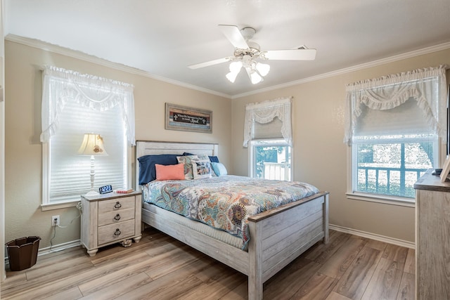 bedroom with multiple windows, crown molding, light hardwood / wood-style floors, and ceiling fan