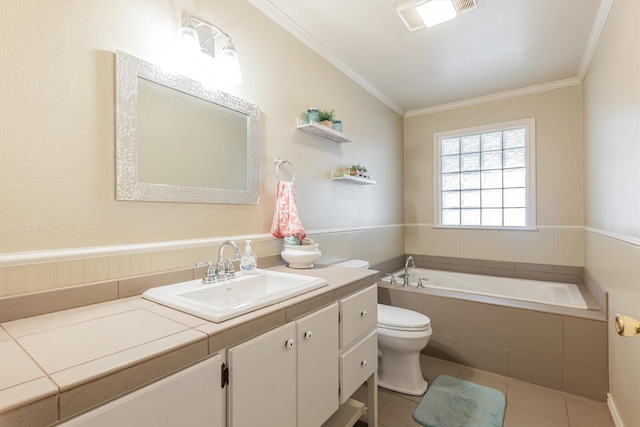 bathroom featuring a relaxing tiled tub, ornamental molding, tile patterned floors, and vanity