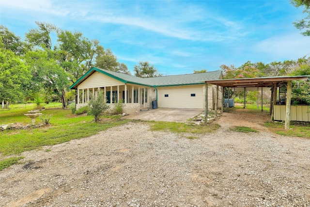 ranch-style house with a carport