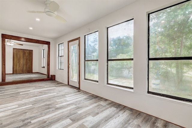 interior space featuring light wood-type flooring and ceiling fan