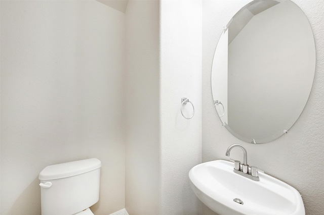 bathroom featuring sink and toilet