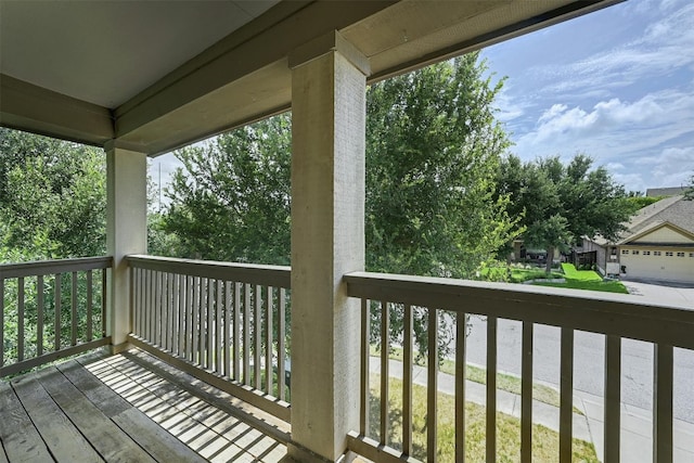 wooden terrace featuring a garage