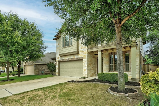 view of front of property featuring a garage and a front yard