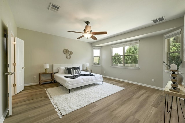 bedroom featuring wood-type flooring and ceiling fan