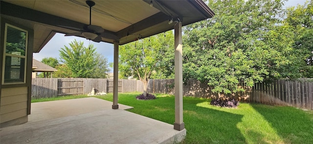 view of yard with a patio and ceiling fan