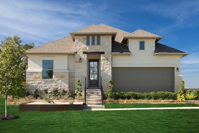 view of front of home featuring a front yard and a garage