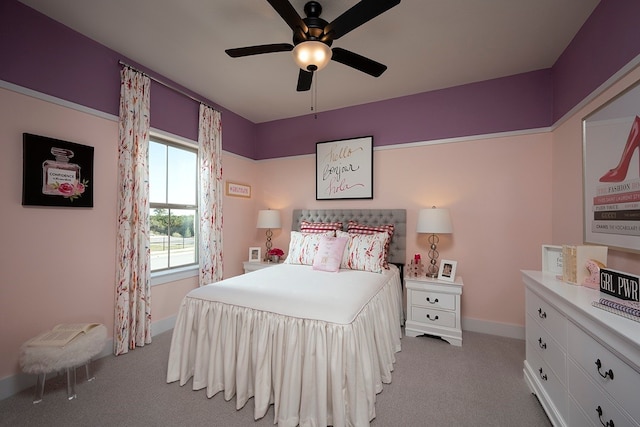 bedroom featuring ceiling fan and light carpet