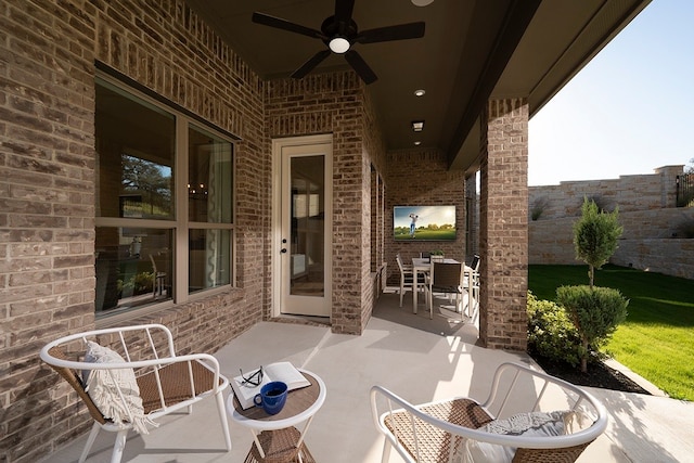 view of patio featuring ceiling fan