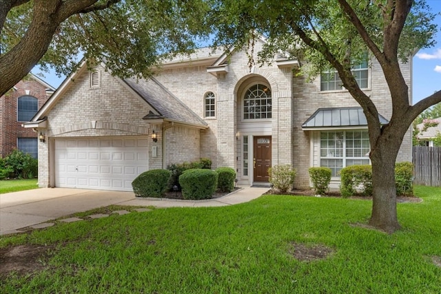 view of front facade with a garage and a front lawn