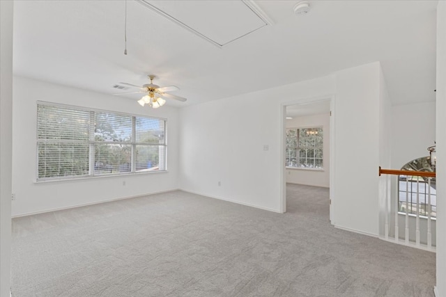 carpeted empty room with ceiling fan