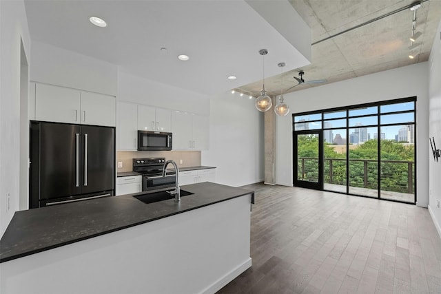 kitchen with black appliances, decorative light fixtures, decorative backsplash, rail lighting, and white cabinetry