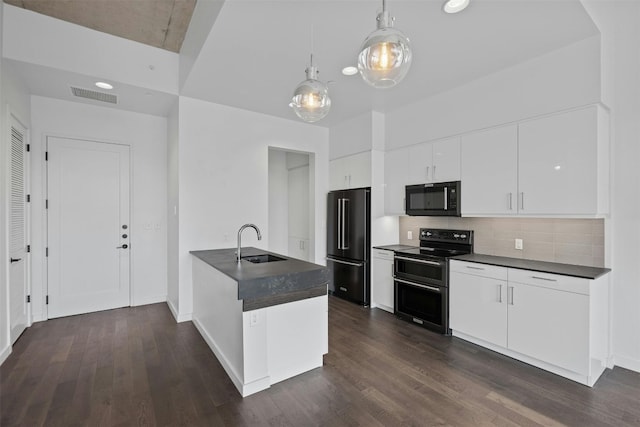 kitchen with black appliances, white cabinets, sink, decorative backsplash, and dark wood-type flooring