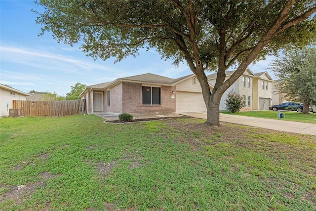 view of front of property with a front yard and a garage