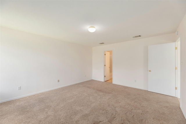 empty room with light carpet and visible vents