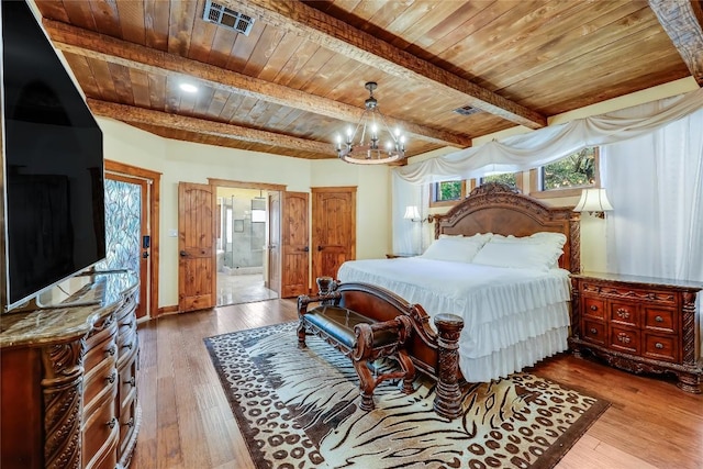 bedroom with connected bathroom, a chandelier, wooden ceiling, beamed ceiling, and hardwood / wood-style floors